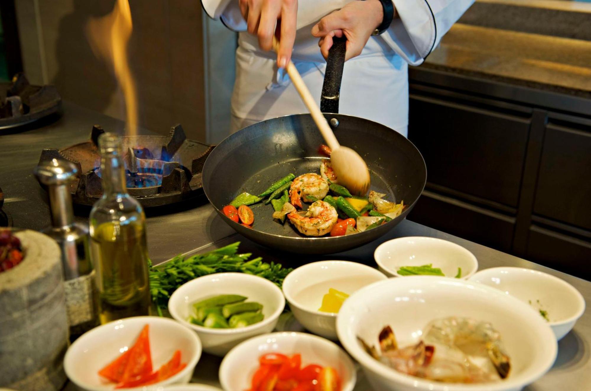 Hyatt Regency Chennai Hotel Exterior photo A wok being used in Chinese cuisine
